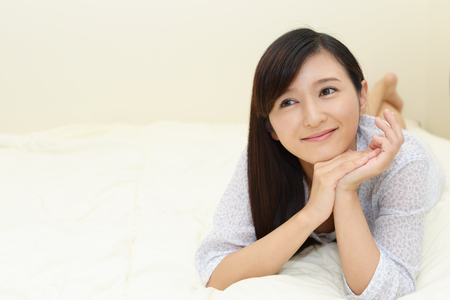 Portrait of an Asian woman at home.の写真素材