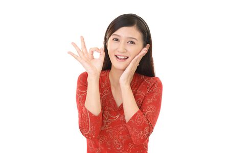 Woman with ok hand signの写真素材