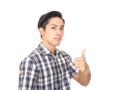 Asian man showing thumbs up signの写真素材