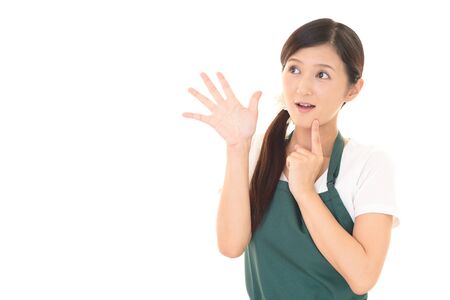 Smiling woman in apronの写真素材