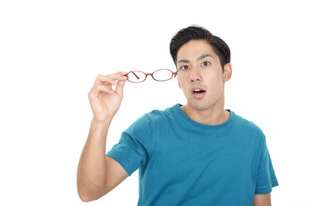 Asian man holding a glassesの写真素材