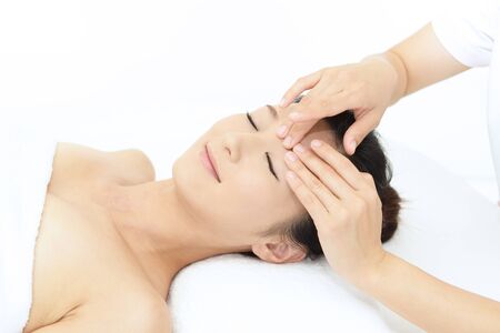 Woman getting a facial massageの写真素材