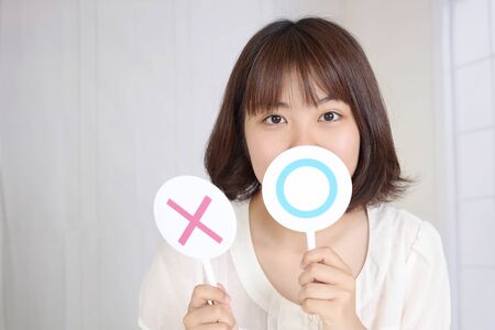 Woman making decision between yes or noの写真素材