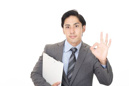 Asian businessman with ok hand signの写真素材
