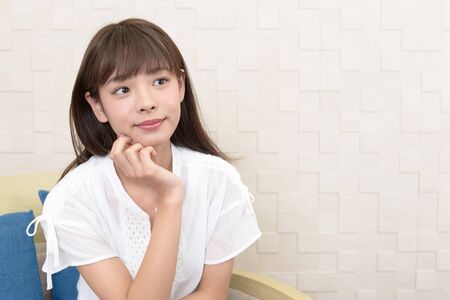 Portrait of an Asian woman at home.の写真素材