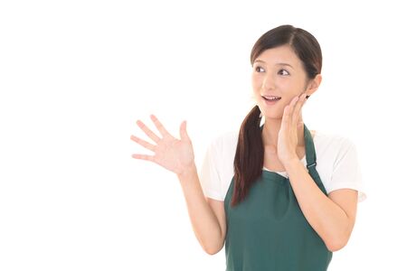 Smiling woman in apronの写真素材