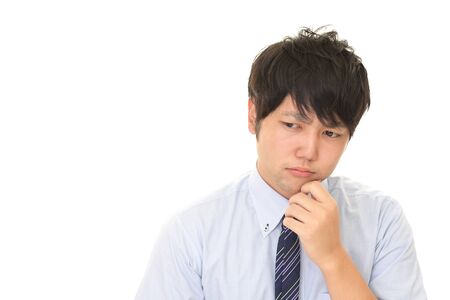 Disappointed Asian businessmanの写真素材