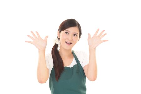 Smiling woman in apronの写真素材