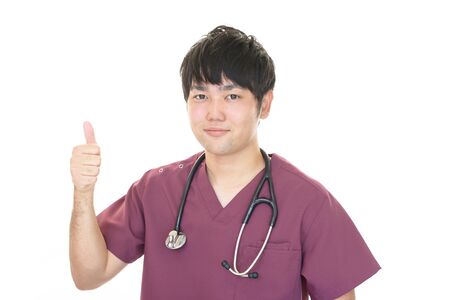 Doctor showing thumbs up signの写真素材