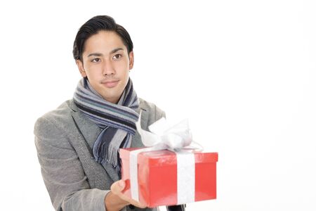 Smiling man with a giftの写真素材