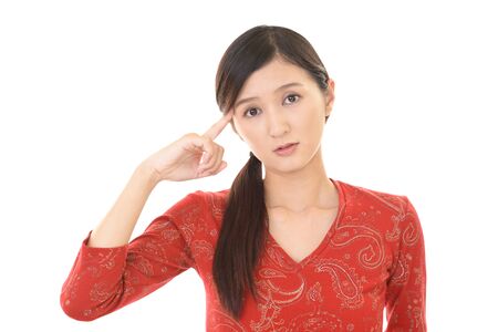 Woman looking thoughtful about troublesの写真素材