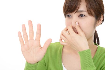 Woman pinches her noseの写真素材