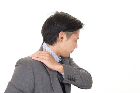Businessman who has a shoulder pain.の写真素材