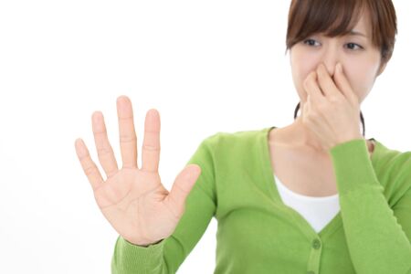 Woman pinches her noseの写真素材