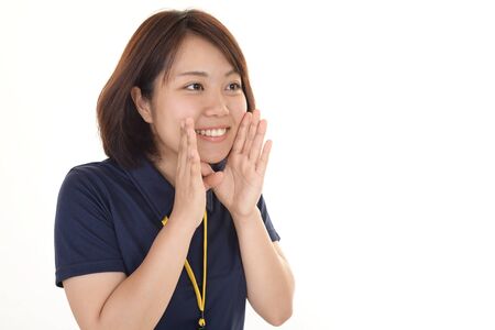 Portrait of young woman calling for someoneの写真素材