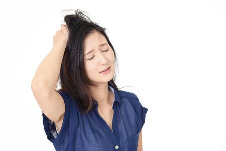Asian woman is feeling tired and stressedの写真素材