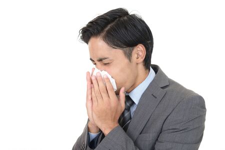 Businessman with a bad coldの写真素材