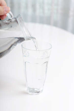 Jug and glass with water.の写真素材