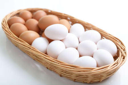 Fresh chicken eggs in basket.の写真素材