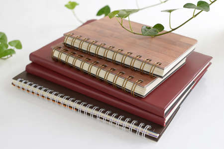 Pile of notebooks on the desk.の写真素材