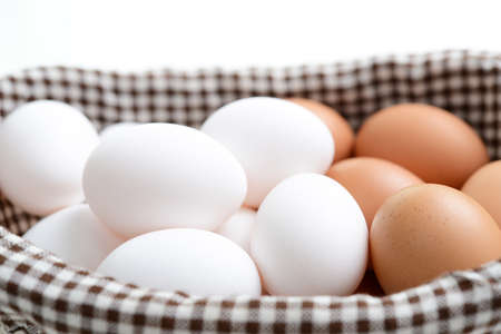 Fresh chicken eggs in basket.の写真素材