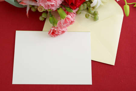 Flat lay flowers with card and nvelope.の写真素材