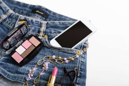 Blue jeans shorts and cosmetics.の写真素材