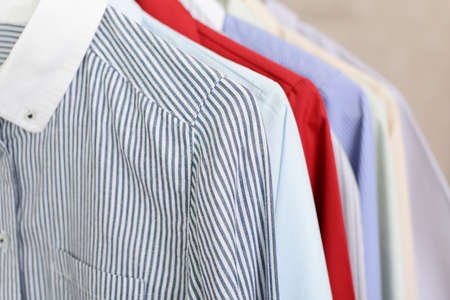 Stylish shirts hanging on hangers.の写真素材