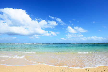 Beautiful beach and tropical sea under blue sky in Okinawa, Japanの写真素材