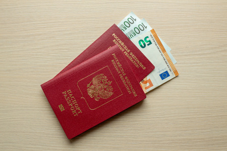 Russian passport and euro on table. Top view.の写真素材