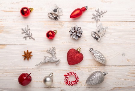 Silver and red christmas gifts on white wooden background. Top viewの写真素材
