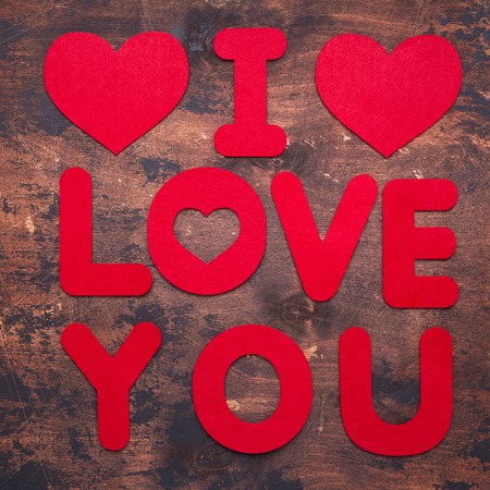 Words I Love You and textile hearts on old wooden background Red textile letters Top view Copy spaceの写真素材