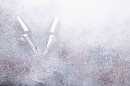 Champagne glasses on light stone background Copy space Top viewの写真素材