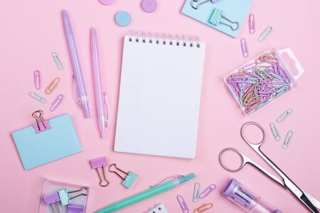 School background with notebooks and pastel colorful study accessories on pink background Back to school concept with copy space for textの写真素材