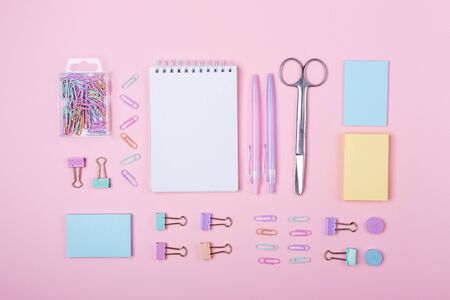 School background with notebook and pastel colorful study accessories on pink background Back to school concept with copy space for textの写真素材