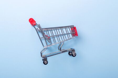 Mini trolley cart copy on blue background Top view Copy space - Imageの写真素材