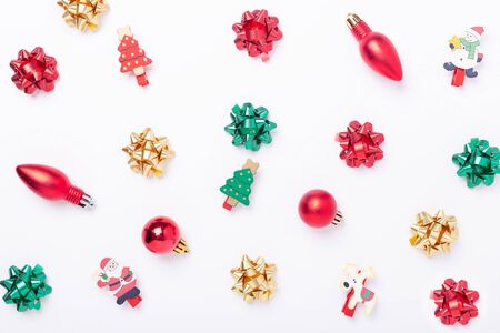 Christmas flat lay background. Red, green, gold gifts and bows on white background. Copy space. Christmas and New Year holiday concept - Imageの写真素材