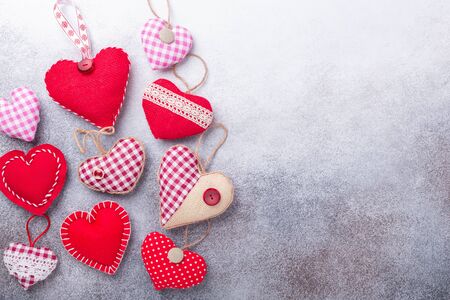Decorative textile hearts on stone background. The concept of Valentine Day. Copy space for your text - Imageの写真素材