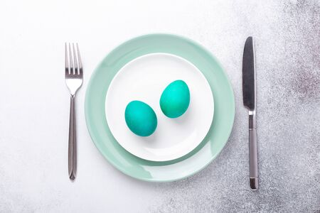 Spring easter table setting with silverware and eggs. Top view. Copy space - Imageの写真素材