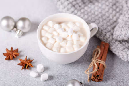 White cup with hot chocolate and marshmallow, sweater, cinnamon. Cozy christmas composition. Hygge concept Soft focus - Imageの写真素材