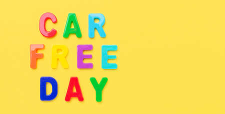 Multicolored text Car Free Day on yellow background. Concept of international car free day on September 22. Top view - Imageの写真素材