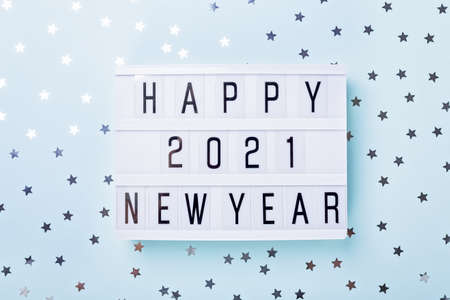 Lightbox with text HAPPY NEW YEAR 2021 on blue background. Top view. New year celebration. Happy New Year 2021 concepts - Imageの写真素材