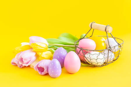 Easter greeting card with decorative painted multicolored eggs and tulips. Easter concept - Image