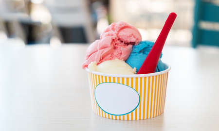 Ice cream in paper cup. Street food. Selective Focus. Copy space