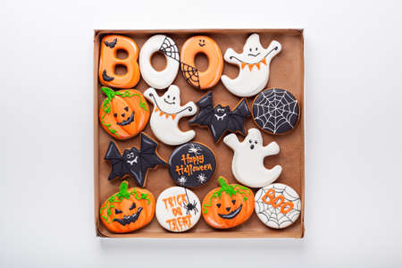 Set of various Halloween gingerbread cookies on white background. Bright homemade cookies for Halloween partyの写真素材