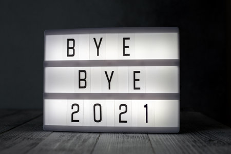 Lightbox with text BYE BYE 2021 in dark room. Hope, new life and Happy New Year 2022 conceptsの写真素材