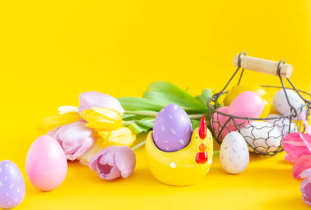 Easter greeting card with decorative chicken and painted eggs. Easter conceptの写真素材