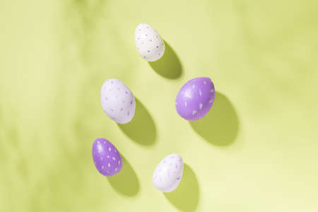 Multicolored easter eggs on green background. Easter concept. Top view. Copy spaceの写真素材