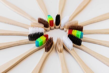 Group of eco bamboo toothbrushes, on white background. Different color. Top view, copy space. Natural organic product for oral hygiene. Dental zero waste and no plastic concept. Safe for the earth. の写真素材