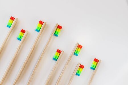 Group of rainbow eco bamboo toothbrushes, on white background. Top view, copy space. Natural organic product for oral hygiene. Dental zero waste and no plastic concept. Safe for the earth.の写真素材